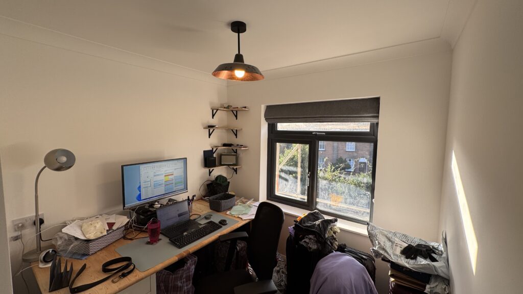 Modern home office in a rear ground floor extension with whole house refurbishment, featuring a spacious desk, ergonomic chair, and natural light.