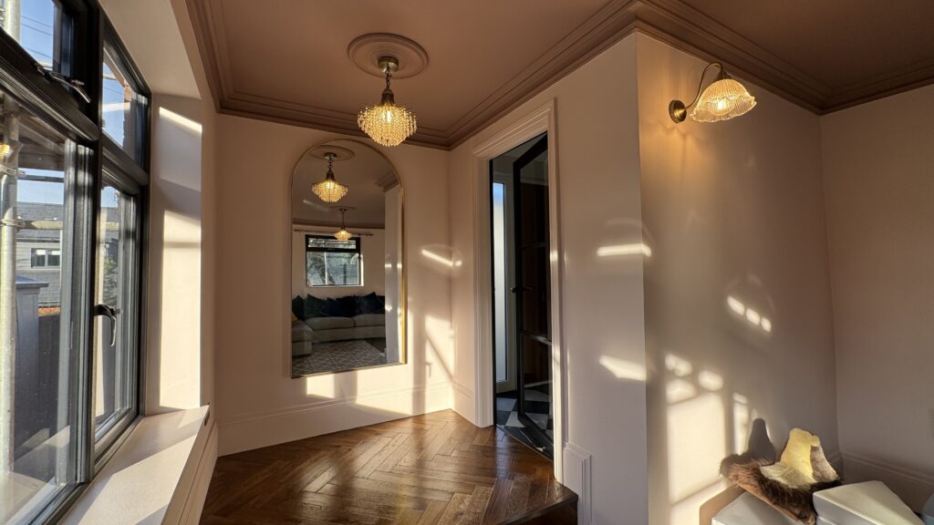 Stylish modern lighting in a rear ground floor extension with whole house refurbishment, creating a warm and inviting ambiance.